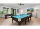 Game room complete with a pool table, foosball table, and TV for entertainment at 4927 Slaton Drive, Acworth, GA 30101