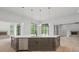 A spacious kitchen island with dark wood cabinets and a stainless steel dishwasher at 4927 Slaton Drive, Acworth, GA 30101