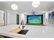 Kitchen island featuring a sink and butcher block, leading to an indoor golf simulator at 4927 Slaton Drive, Acworth, GA 30101