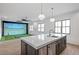 Wet bar adjacent to a recreation room featuring custom cabinets, stone countertops and stainless steel appliances at 4927 Slaton Drive, Acworth, GA 30101
