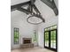 An airy living room featuring a fireplace, wooden ceiling beams, and a chandelier at 4927 Slaton Drive, Acworth, GA 30101
