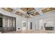 Open-concept living room with coffered ceiling and hardwood flooring, connecting to the kitchen at 4927 Slaton Drive, Acworth, GA 30101