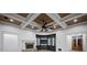 Living room featuring coffered ceilings, stone fireplace, and custom shelving provides a welcoming atmosphere at 4927 Slaton Drive, Acworth, GA 30101