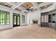 Bright living room with coffered ceiling, fireplace, hardwood floors and custom built-ins at 4927 Slaton Drive, Acworth, GA 30101