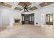 Spacious living room with coffered wood ceilings, stone fireplace, and custom built-ins showcases architectural details at 4927 Slaton Drive, Acworth, GA 30101