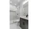 Main bathroom with a glass enclosed walk-in shower, gray vanity with a sink, and sleek, modern fixtures at 4927 Slaton Drive, Acworth, GA 30101