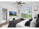 Stylish main bedroom features large window, TV, and ensuite bathroom access, creating a relaxing retreat at 4927 Slaton Drive, Acworth, GA 30101