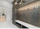 Custom mudroom with built-in shelves, cabinets, seating, and hooks for optimal organization and storage at 4927 Slaton Drive, Acworth, GA 30101