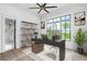 Stylish home office with a large window, chic shelving, and modern decor offers an inspiring workspace at 4927 Slaton Drive, Acworth, GA 30101