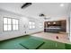 A recreation room with indoor putting green, wet bar, and large windows with black trim at 4927 Slaton Drive, Acworth, GA 30101