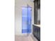 Glass shower door, custom faucet, and blue tile inside shower at 4927 Slaton Drive, Acworth, GA 30101
