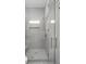 Modern shower showcasing neutral tiles, a built-in bench, and glass enclosure, creating a spa-like experience at 4927 Slaton Drive, Acworth, GA 30101