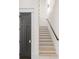 Bright stairway with white risers and wood treads ascending to the upper level of this home at 4927 Slaton Drive, Acworth, GA 30101