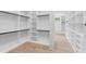 Large walk-in closet with custom shelving and drawers, offering abundant space for storage and organization at 4927 Slaton Drive, Acworth, GA 30101