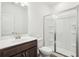 Bathroom featuring a single sink vanity and a tiled walk-in shower at 5391 Heron Bay Blvd, Locust Grove, GA 30248