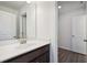 Bathroom featuring dark wood cabinets and a white countertop sink at 5391 Heron Bay Blvd, Locust Grove, GA 30248