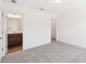 Spacious bedroom featuring neutral carpet, white walls, and an ensuite bathroom for added convenience at 5391 Heron Bay Blvd, Locust Grove, GA 30248