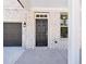 Home featuring a welcoming covered entrance, a dark front door, and painted brick at 5391 Heron Bay Blvd, Locust Grove, GA 30248