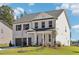 Charming two-story brick home featuring an attached two-car garage and a well-manicured front lawn at 5391 Heron Bay Blvd, Locust Grove, GA 30248
