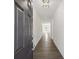 Bright foyer featuring hardwood floors, white walls, and an open floor plan at 5391 Heron Bay Blvd, Locust Grove, GA 30248