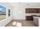 Open concept kitchen with stainless steel appliances and island at 5391 Heron Bay Blvd, Locust Grove, GA 30248