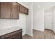 Gourmet kitchen with stainless appliances, stone backsplash, and island at 5391 Heron Bay Blvd, Locust Grove, GA 30248