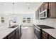 Bright kitchen features an island, modern appliances, and white countertops at 5391 Heron Bay Blvd, Locust Grove, GA 30248