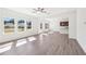Sun-filled living room with large windows and hardwood floors at 5391 Heron Bay Blvd, Locust Grove, GA 30248