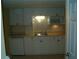 Small basement kitchen with white cabinets at 295 Flagstone Way # 295, Austell, GA 30168
