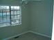 Simple bedroom with ceiling fan and window blinds at 295 Flagstone Way # 295, Austell, GA 30168