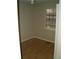 Bedroom with hardwood floor and window with blinds at 295 Flagstone Way # 295, Austell, GA 30168