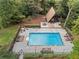 Aerial view of a home featuring a pool, patio, and lush landscaping in a private backyard at 9650 Coleman Rd, Roswell, GA 30075