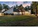 Expansive backyard and patio featuring ample outdoor seating and a well-manicured lawn at 9650 Coleman Rd, Roswell, GA 30075