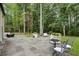 Spacious backyard with a large stone patio, perfect for outdoor entertaining and relaxation at 9650 Coleman Rd, Roswell, GA 30075