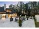 Backyard patio featuring modern outdoor furniture and landscaping, with a home in the background at 9650 Coleman Rd, Roswell, GA 30075