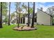 Expansive backyard with a modern home, landscaped yard, and mature trees at 9650 Coleman Rd, Roswell, GA 30075