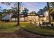Enjoy the spacious backyard, perfect for entertaining with a stone patio and lush greenery at 9650 Coleman Rd, Roswell, GA 30075