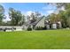 Beautiful exterior with a lush green lawn and meticulously maintained landscaping, showcasing curb appeal at 9650 Coleman Rd, Roswell, GA 30075
