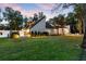 Exterior view of a modern home with well-maintained landscaping and a spacious yard at 9650 Coleman Rd, Roswell, GA 30075