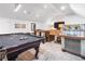 Inviting game room with a classic jukebox, plush seating, and a pool table for entertainment at 9650 Coleman Rd, Roswell, GA 30075