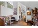 Open hallway with hardwood floors, marble fireplace, and decorative furnishings at 9650 Coleman Rd, Roswell, GA 30075