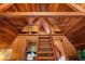 The interior features wooden architecture, a ladder, and an A-frame structure, with a view of the office at 9650 Coleman Rd, Roswell, GA 30075