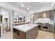 Open-concept kitchen featuring a large island, stainless steel appliances, and an open view to the living room at 9650 Coleman Rd, Roswell, GA 30075