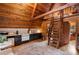 Charming A-frame kitchen with wood paneling, modern appliances, and a cozy vintage-style refrigerator and cabinets at 9650 Coleman Rd, Roswell, GA 30075