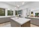 Modern kitchen with quartz countertops, island, stainless appliances, and pendant lighting at 9650 Coleman Rd, Roswell, GA 30075