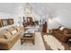 Open-concept living and dining area with modern furnishings and hardwood floors at 9650 Coleman Rd, Roswell, GA 30075