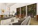 Inviting living room showcasing large windows, a grand piano, and stylish furniture at 9650 Coleman Rd, Roswell, GA 30075