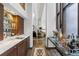 Elegant wet bar flows into the expansive, bright living room with soaring ceilings and lovely hard wood floors at 9650 Coleman Rd, Roswell, GA 30075