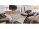 Relaxing living room featuring comfortable seating, a media center with a large TV, and stylish decor at 9650 Coleman Rd, Roswell, GA 30075
