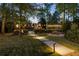 Tranquil backyard scene with an inviting swimming pool and charming string lights for evening enjoyment at 9650 Coleman Rd, Roswell, GA 30075